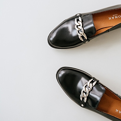 Mocassins with silver buckle in black leather