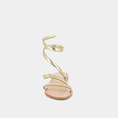 Sandals with twisted straps in gold metallic leather
