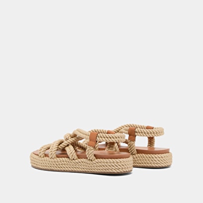 Sandals with cross-over straps in beige rope