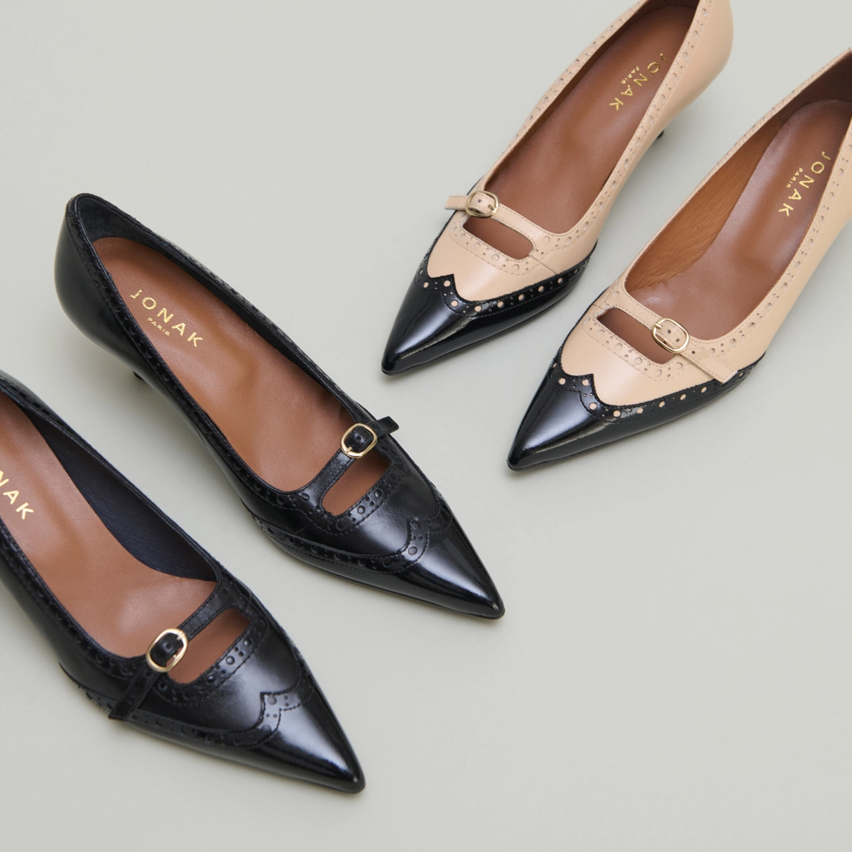 Strappy pumps with perforated details in black patent and black leather | DALTA