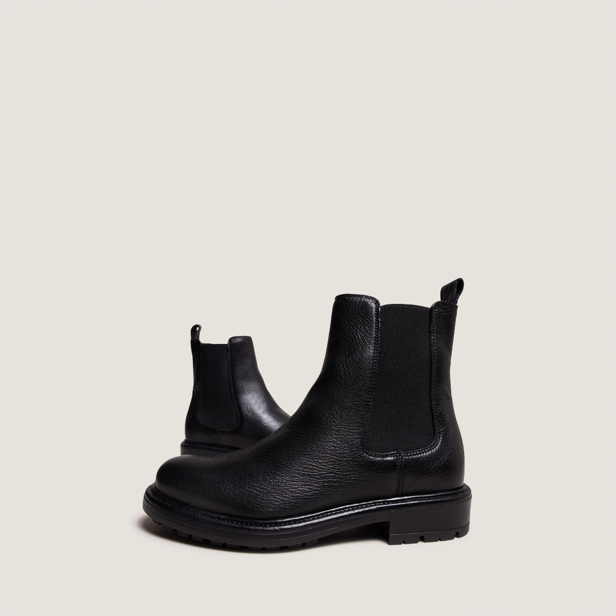 Lowboots with elastic straps and notched soles in black grained leather | CELINA