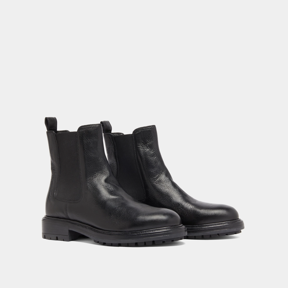Lowboots with elastic straps and notched soles in black grained leather | CELINA