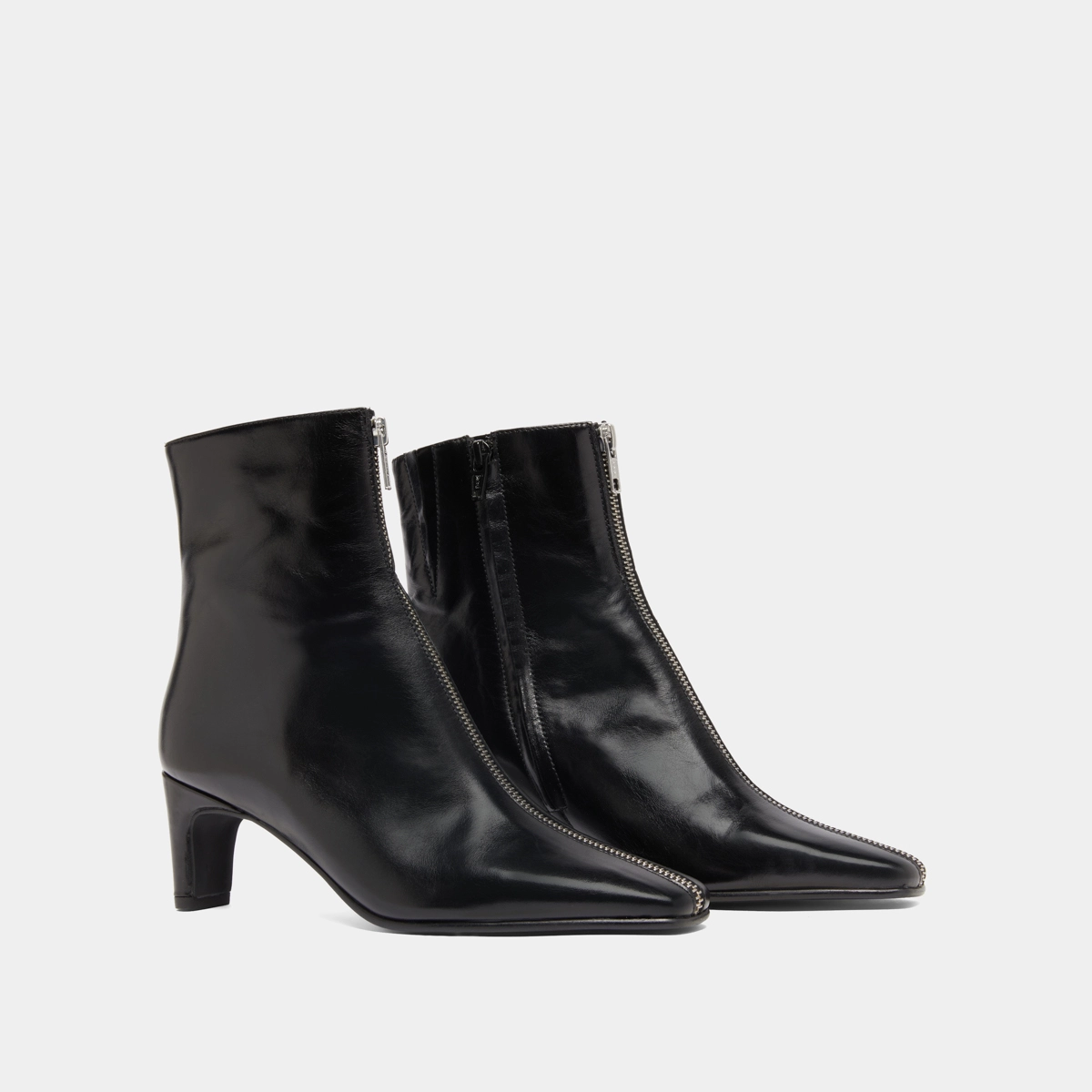 Heeled ankle boots with front zippers in black leather | DANZA
