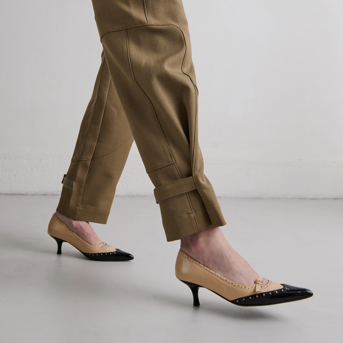 Pumps with straps and perforated details in black patent and beige leather | DALTA