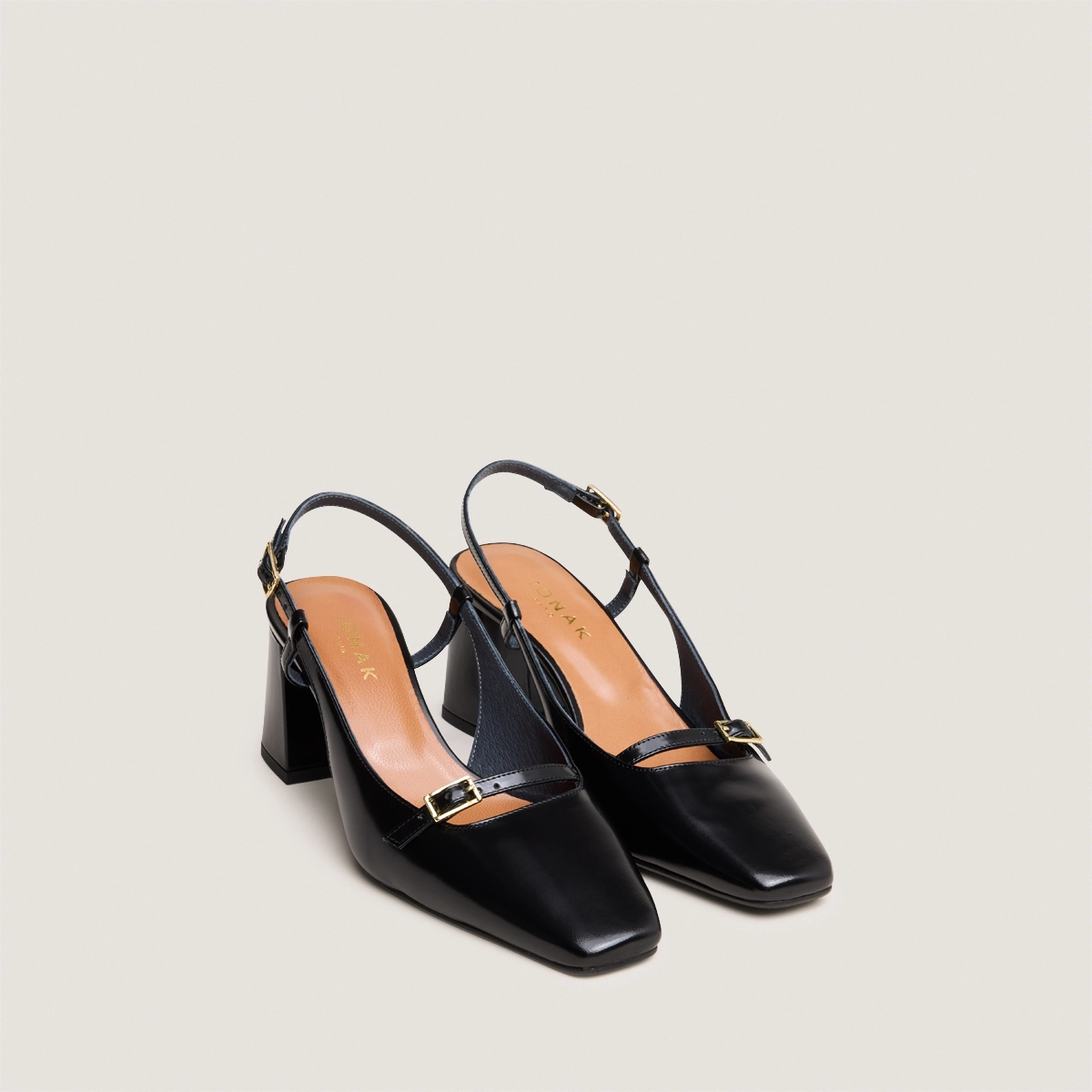 Heeled slingbacks in black glazed leather | DADELLE