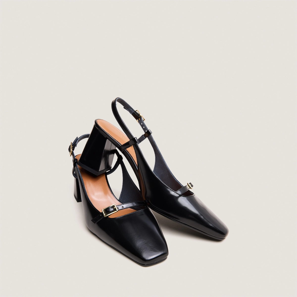 Heeled slingbacks in black glazed leather | DADELLE