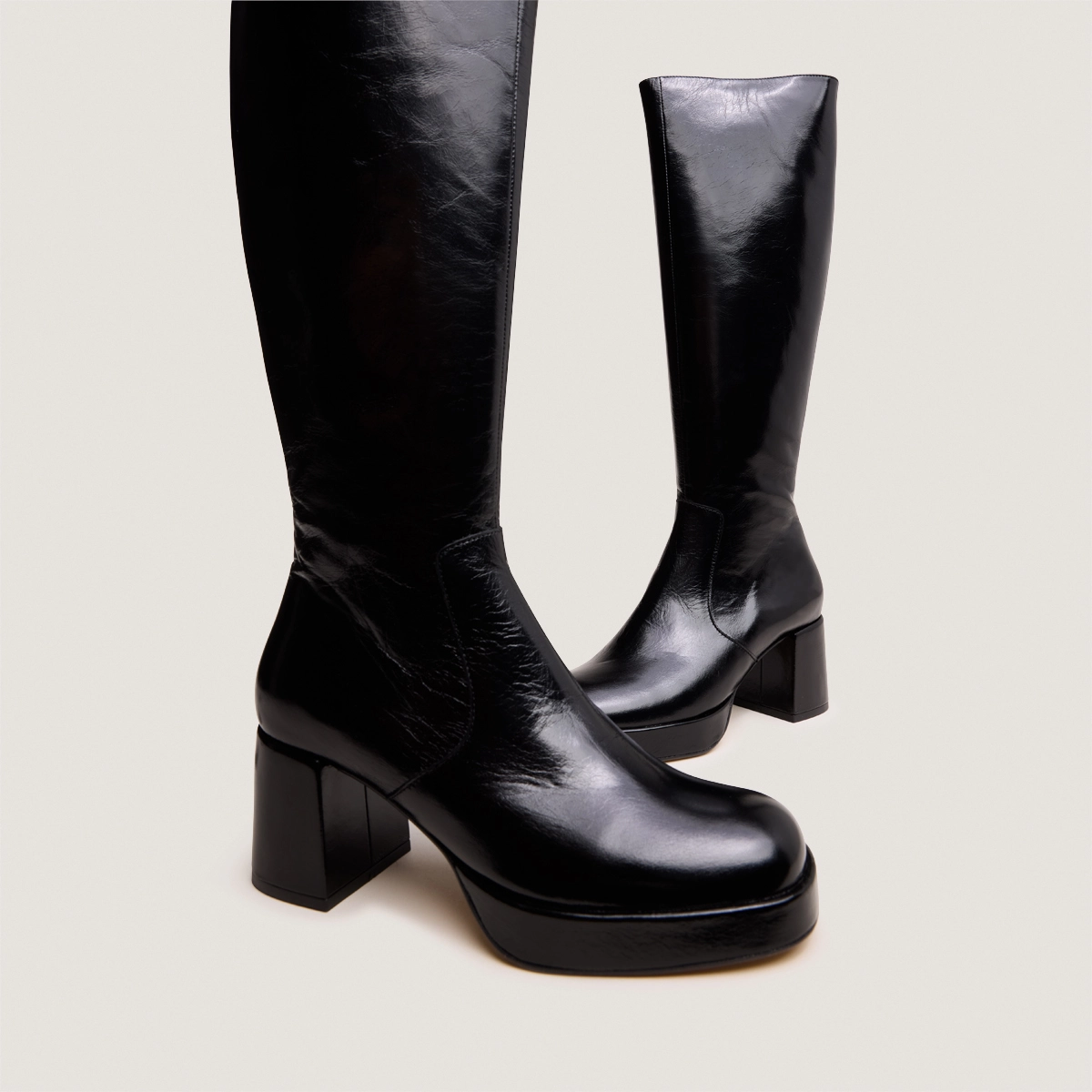Heeled platform boots in black distressed leather | VANEO