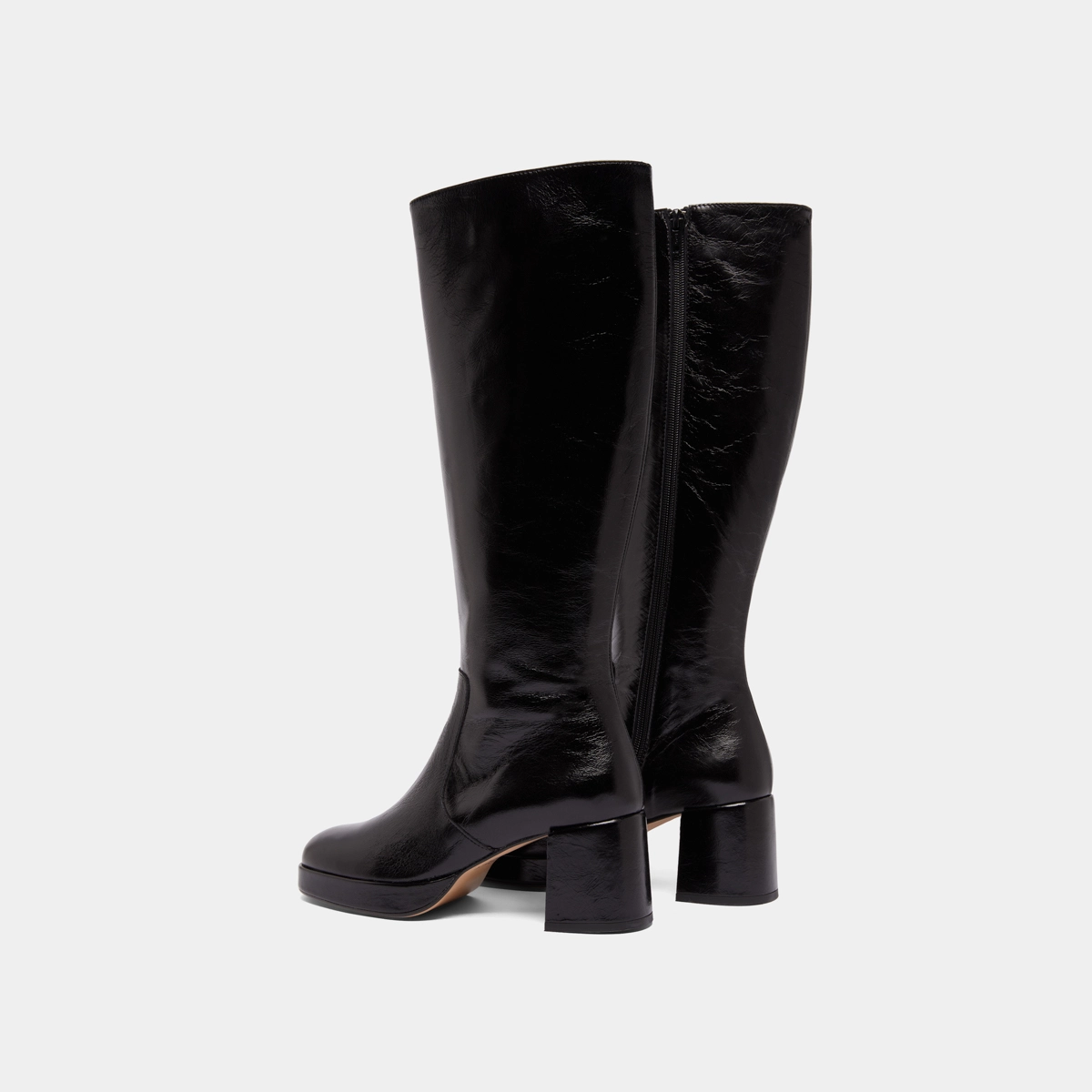 Heeled platform boots in black distressed leather | VANEO