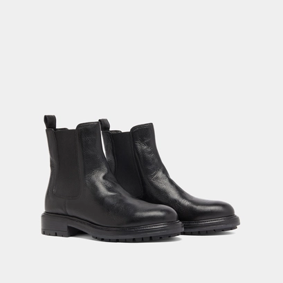 Lowboots with elastic straps and notched soles in black grained leather | celina