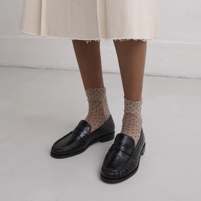 Round-toed loafers in black distressed leather | delice
