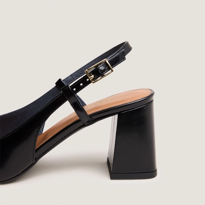 Heeled slingbacks in black glazed leather | dadelle