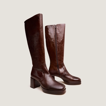 Heeled platform boots in brown distressed leather | vaneo