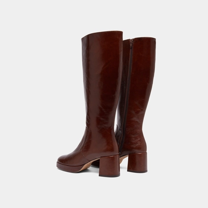 Heeled platform boots in brown distressed leather | vaneo