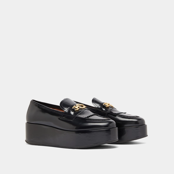 Gold buckle loafers in black glazed leather | DELPHES