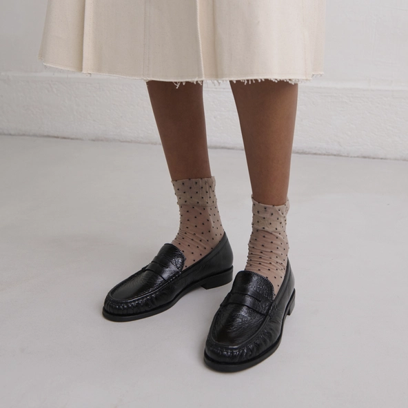 Round-toed loafers in black distressed leather | DELICE