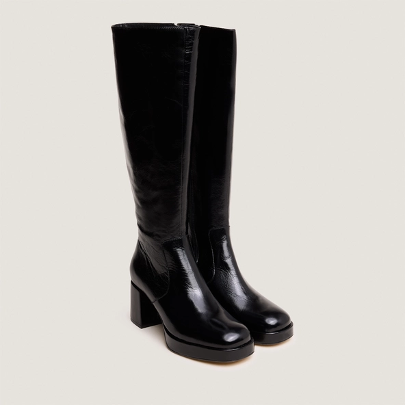 Heeled platform boots in black distressed leather | VANEO