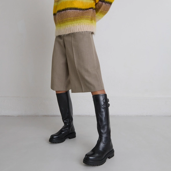 High boots with notched soles and buckles in black leather | ADALIA
