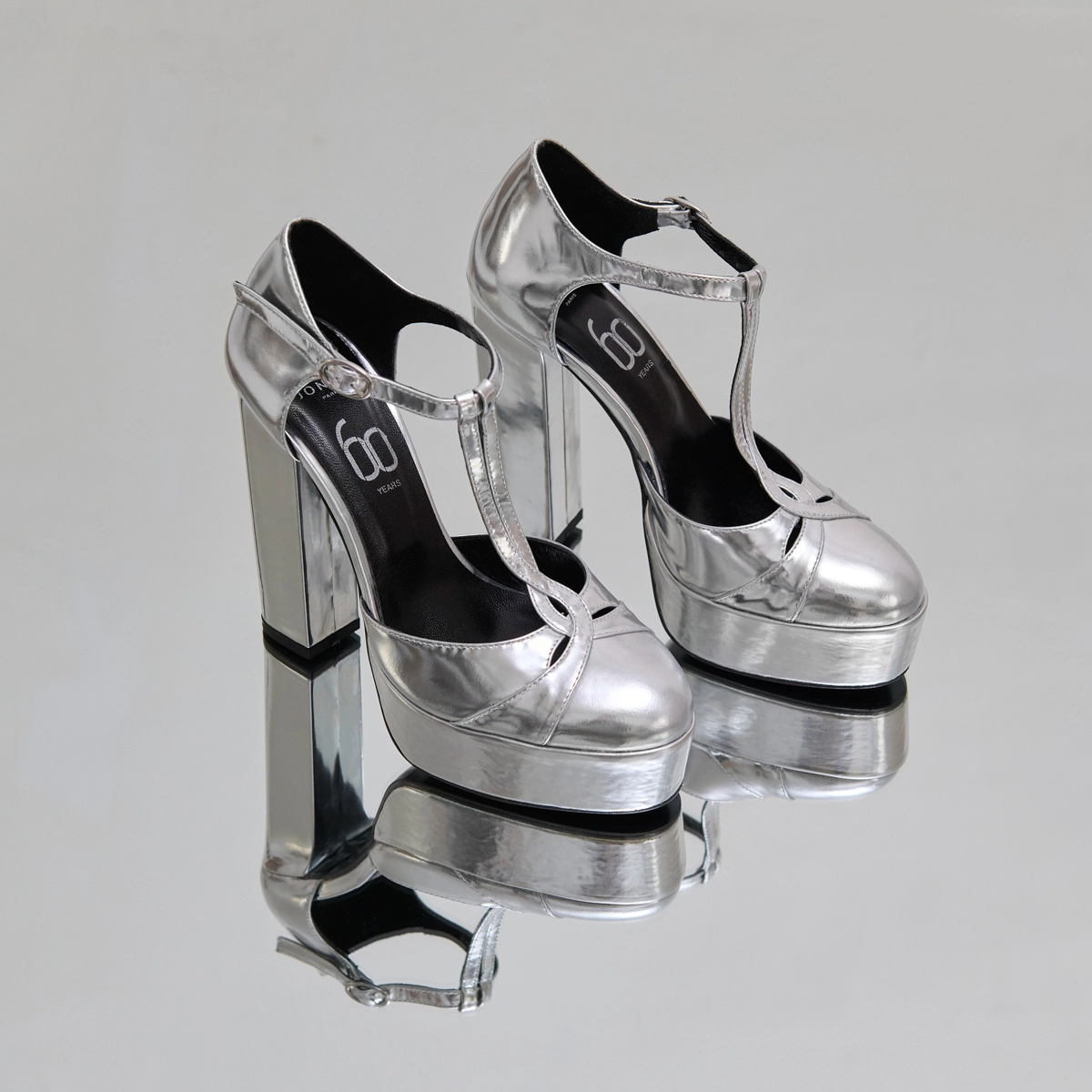 Heeled T-bar and platforms in silver metallic leather | REWIND