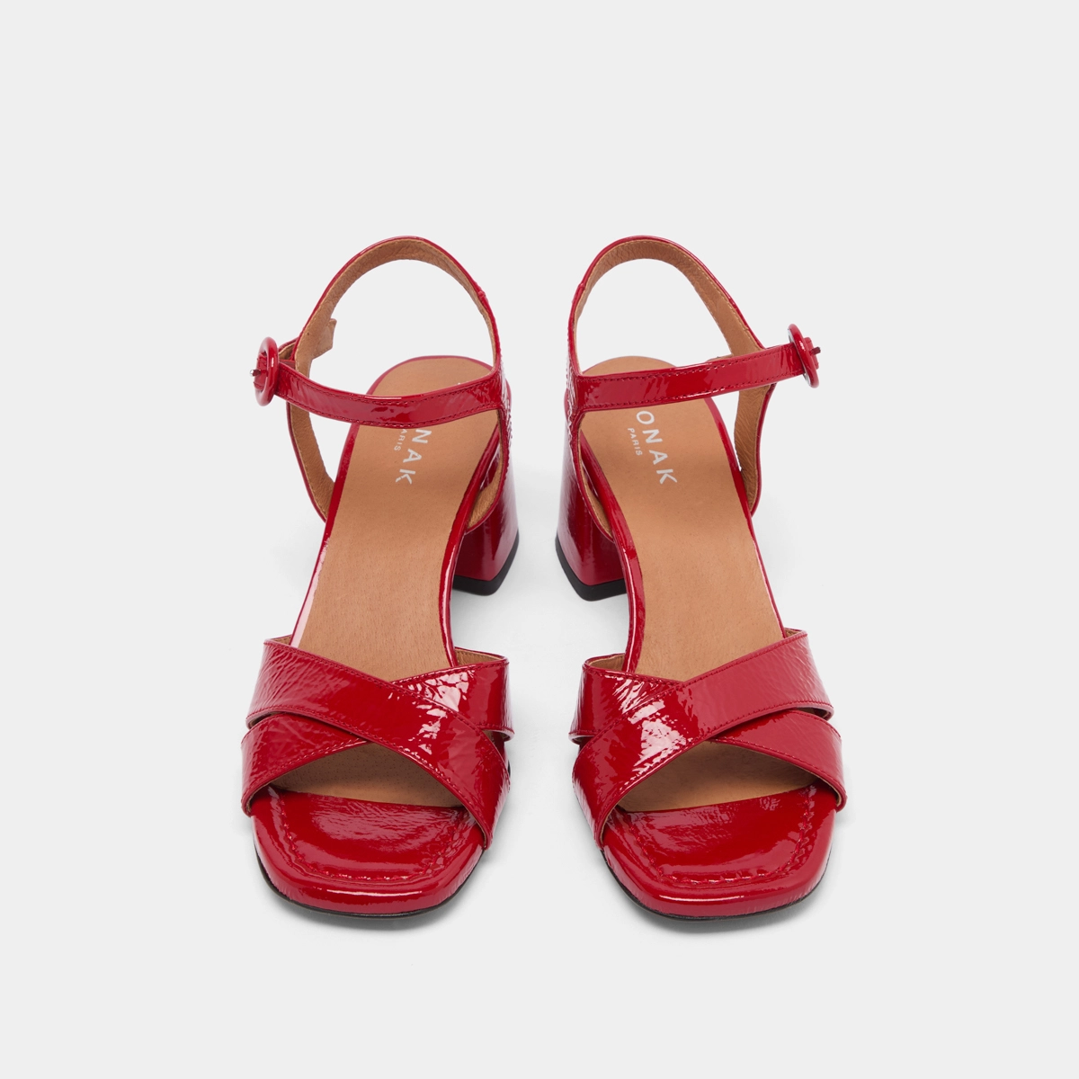 Heeled sandals in red pleated varnish | BRIELLA