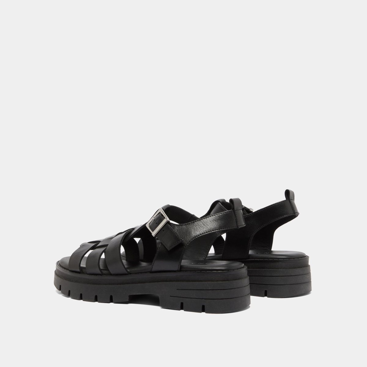 Sandals with notched soles in black leather | ANASTASIA