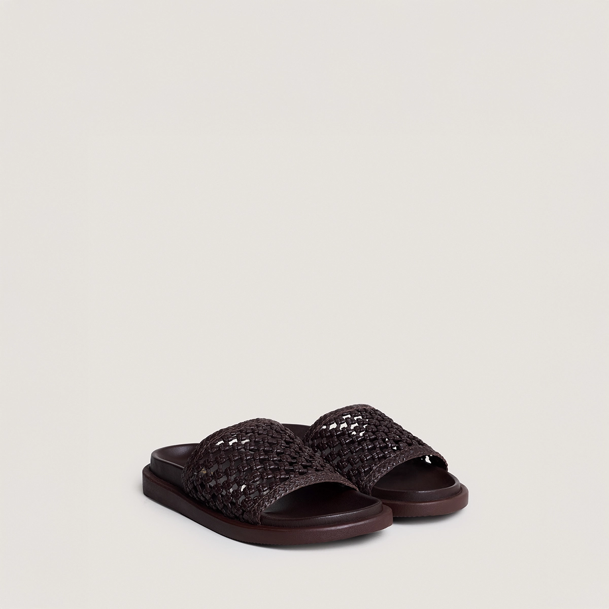 Openwork mules in dark brown leather | WOZART