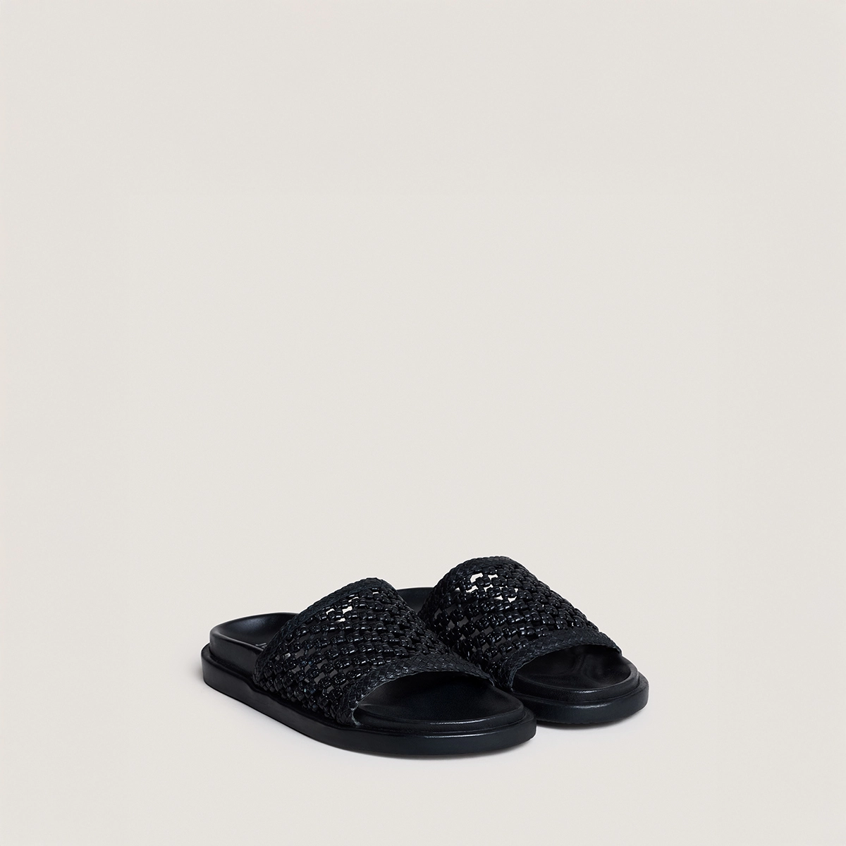 Openwork mules in black leather | WOZART