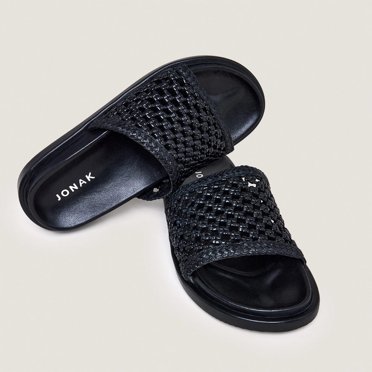 Openwork mules in black leather | WOZART