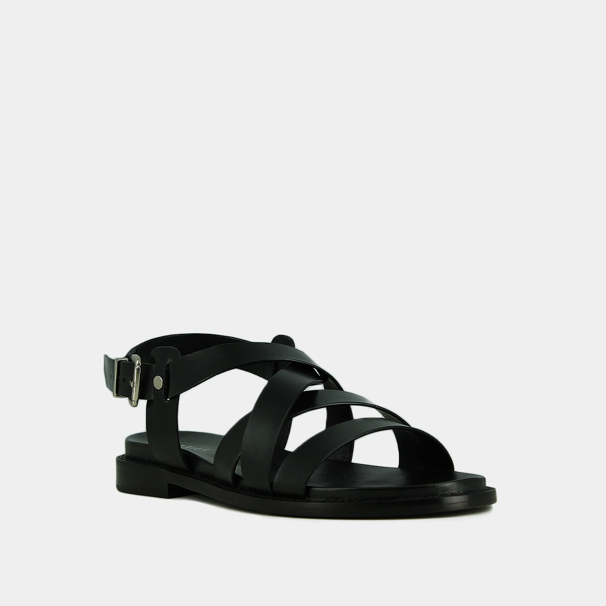 Sandals with criss-cross straps and adjustable buckles in black leather | WOKY