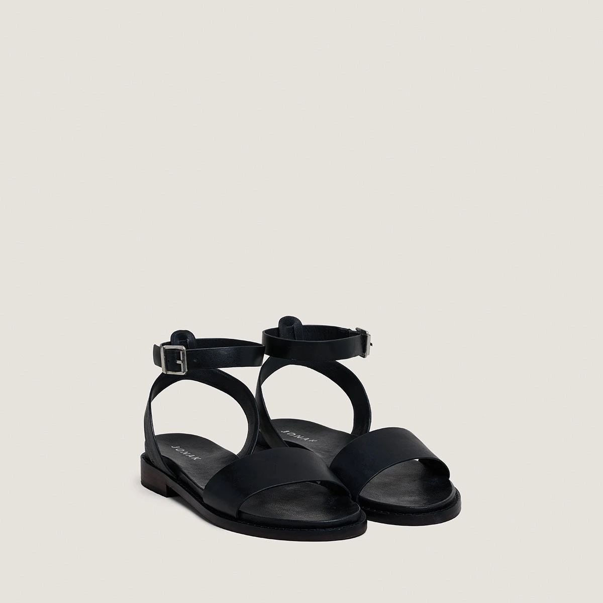 Sandals with straps and adjustable buckles in black leather | WIK