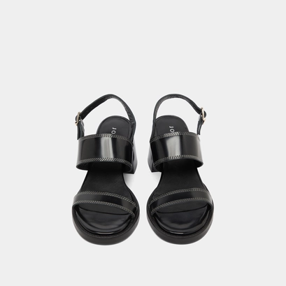 Heeled sandals in black glazed leather | blondine