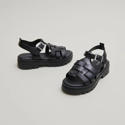 Sandals with notched soles in black leather | anastasia