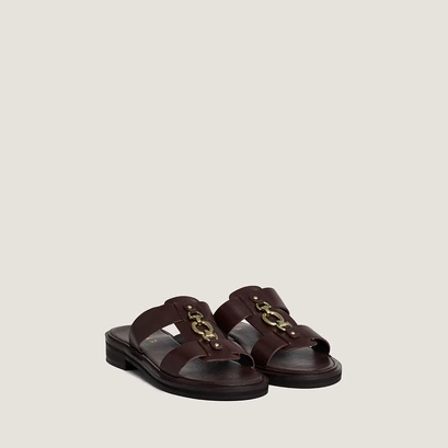 Mules with golden bits in dark brown leather | dop