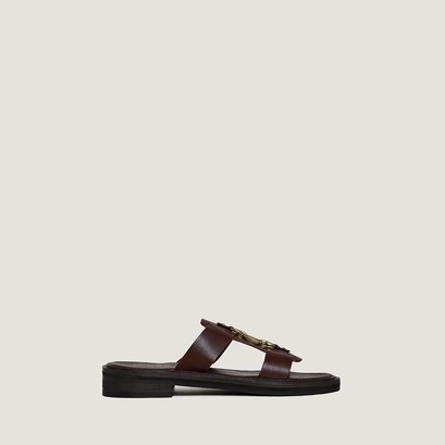 Mules with golden bits in dark brown leather | dop