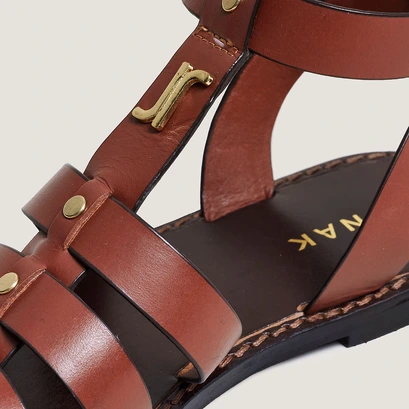 Monogrammed sandals with adjustable buckles in cognac leather | wan