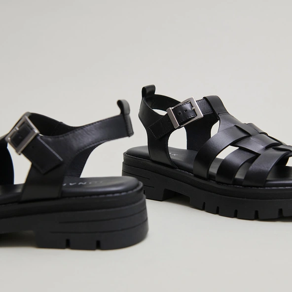 Sandals with notched soles in black leather | ANASTASIA