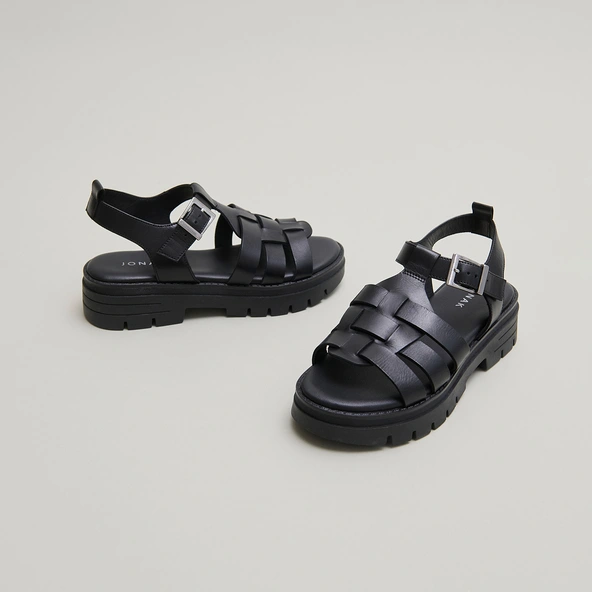 Sandals with notched soles in black leather | ANASTASIA