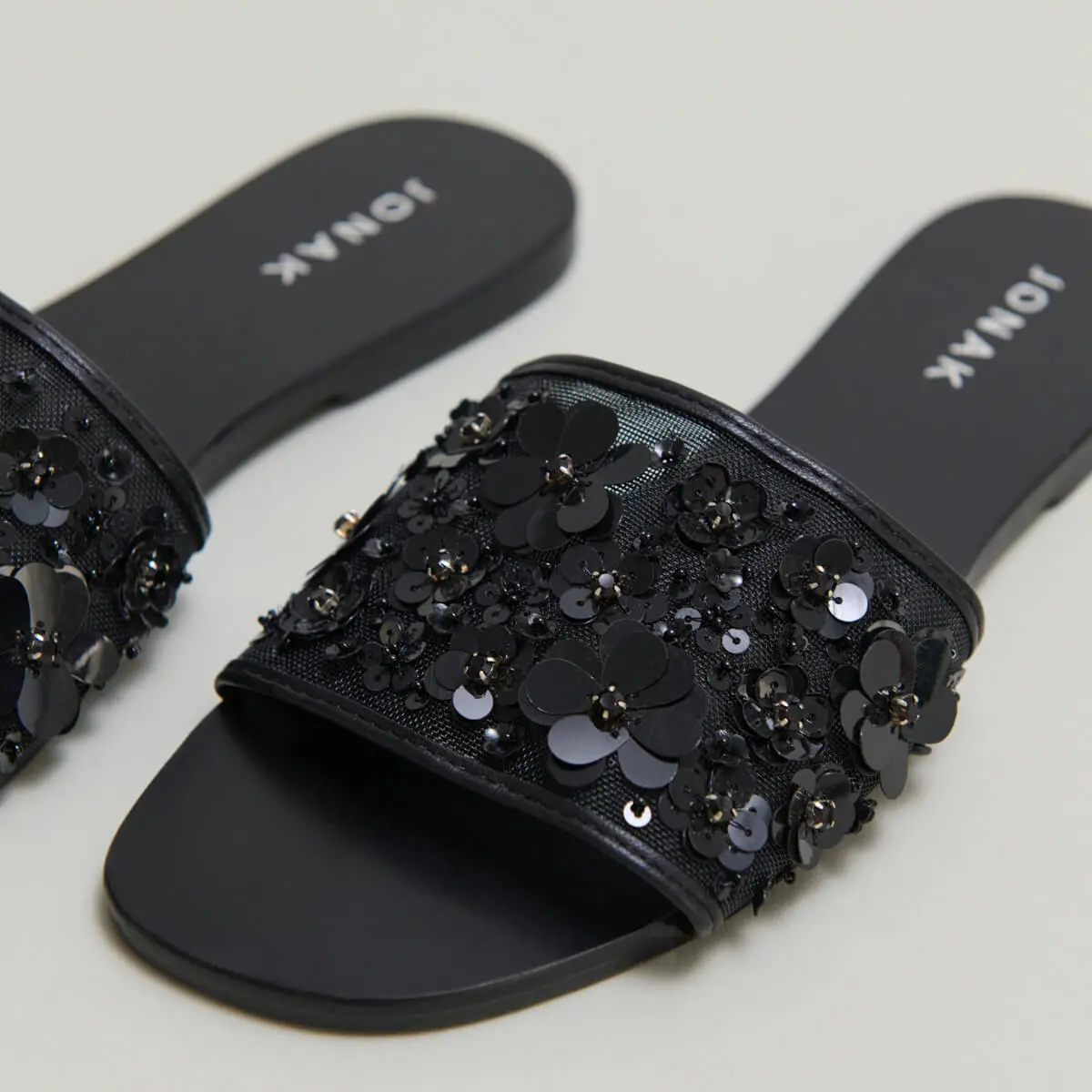 Beach sandals with flowers in black leather and black textile | SUN