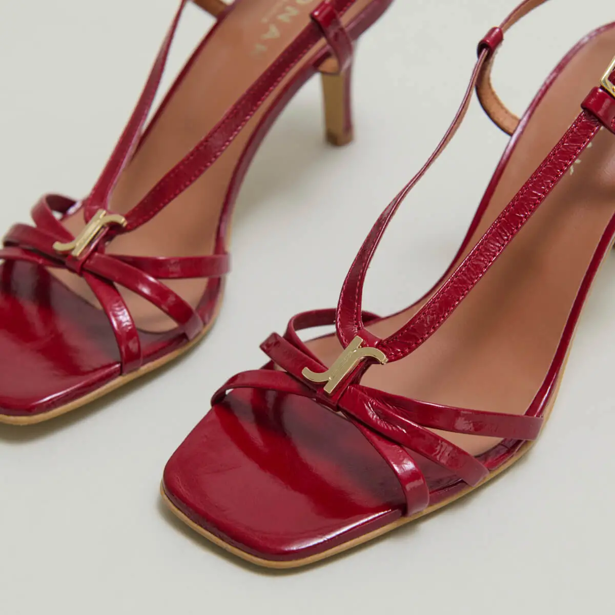 Heeled sandals with monograms in red carmine shiny leather | VOMA