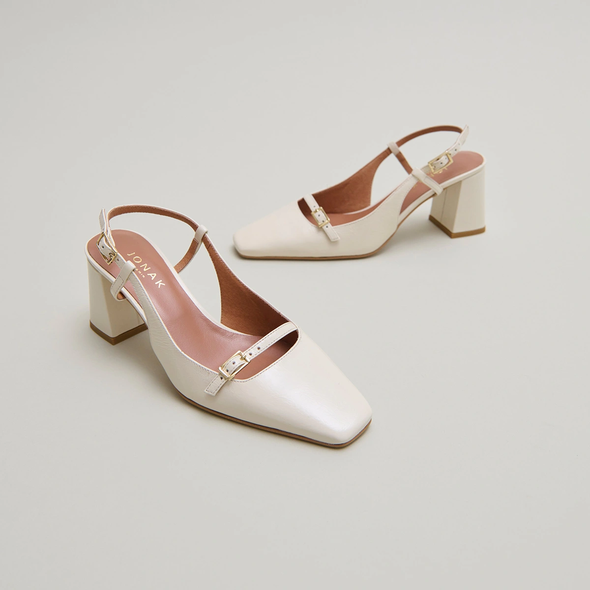 Heeled slingbacks in ecru shiny leather | DADELLE