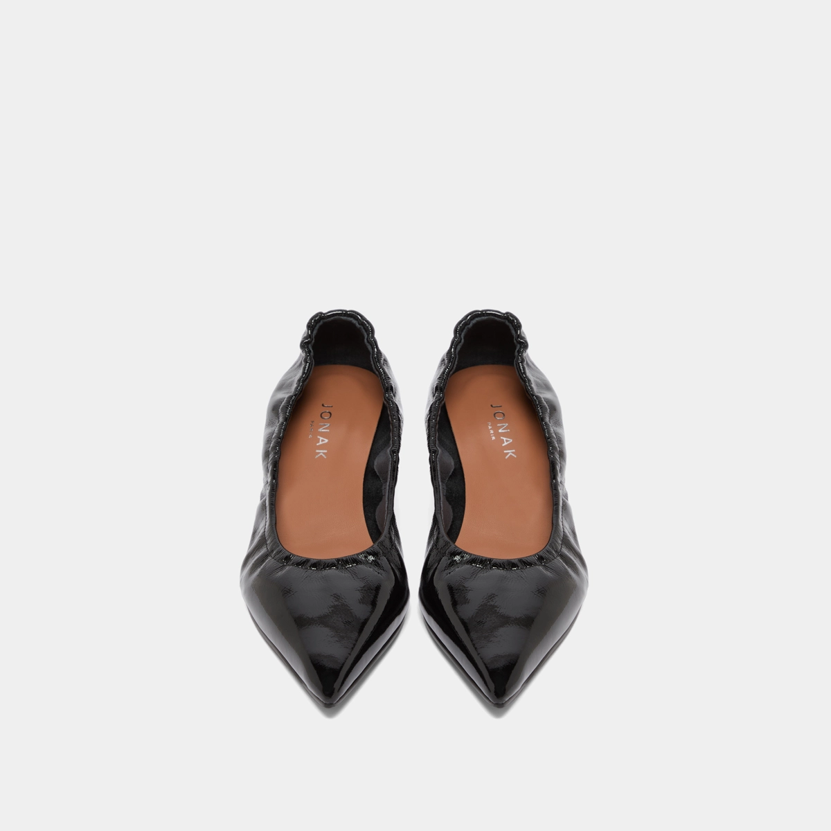 Pointed-toe pumps in black pleated varnish | DOUA