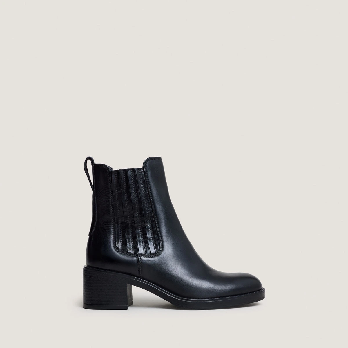 Heeled Boots in black leather | COLETTE