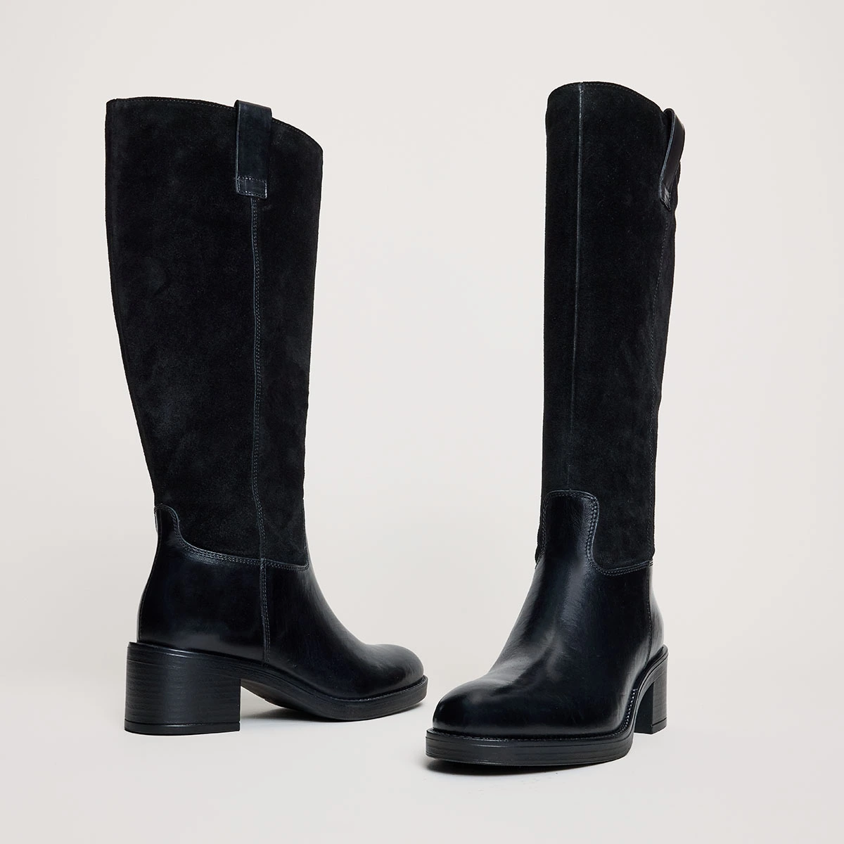 Heeled boots in black leather and suede | CLAIRE