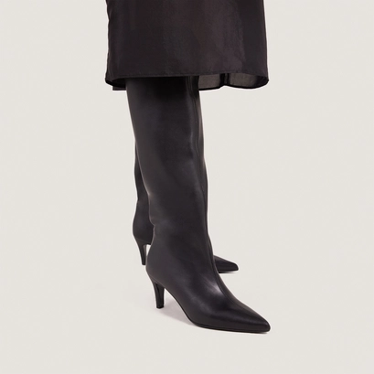 Heeled pointed-toe boots in soft black leather | delaine