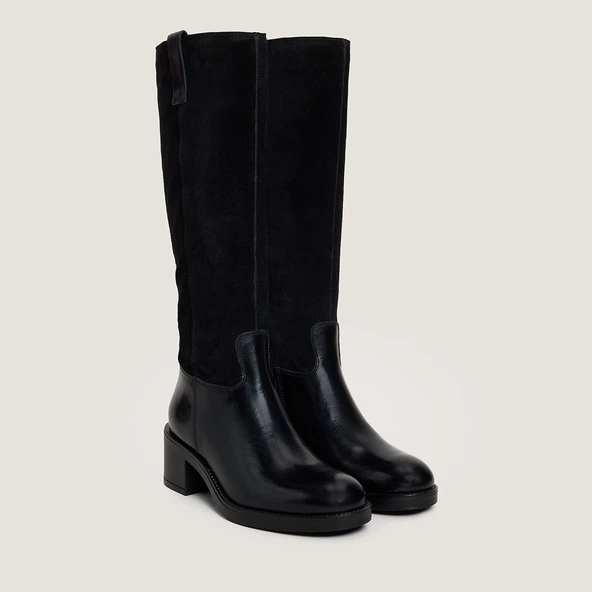 Heeled boots in black leather and suede | CLAIRE