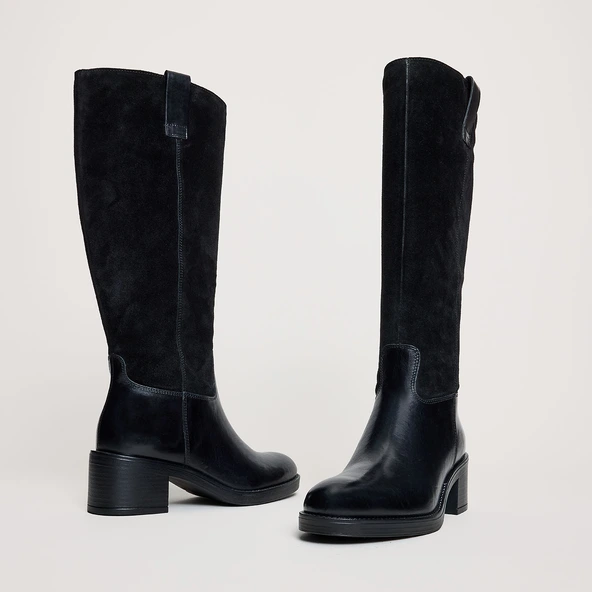 Heeled boots in black leather and suede | CLAIRE