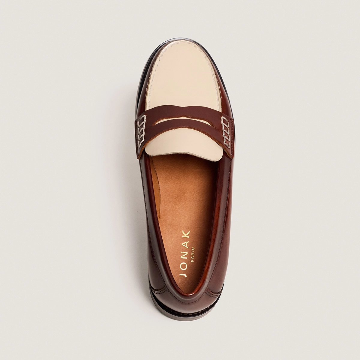 Loafers with pinched platform soles in brown and ecru glossy leather | AUDELYA