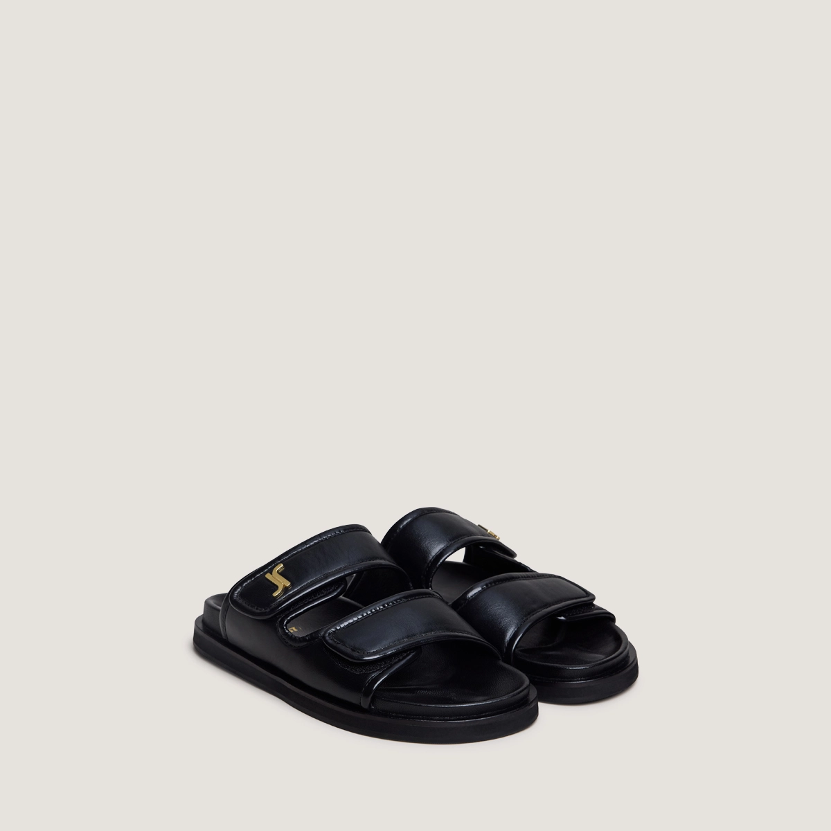 Monogrammed mules in black leather | WIN