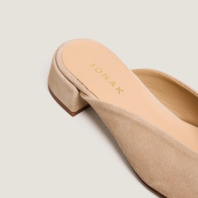 Flat mules and low heel in ivory split leather | nine