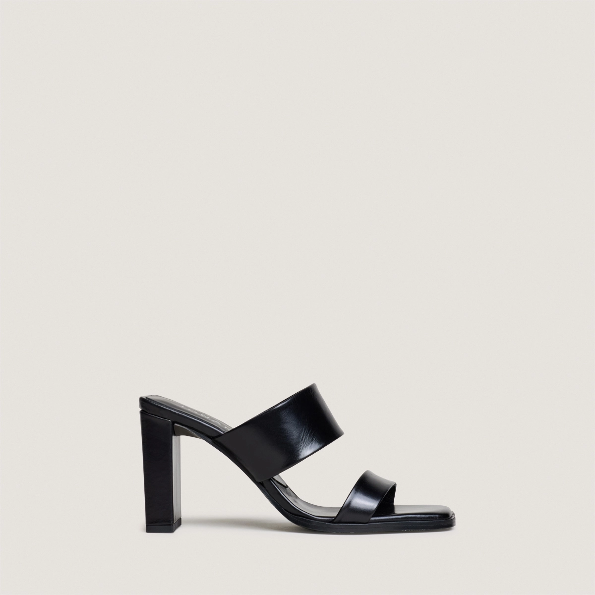 Heeled mules with double straps in black leather | BRITNEY