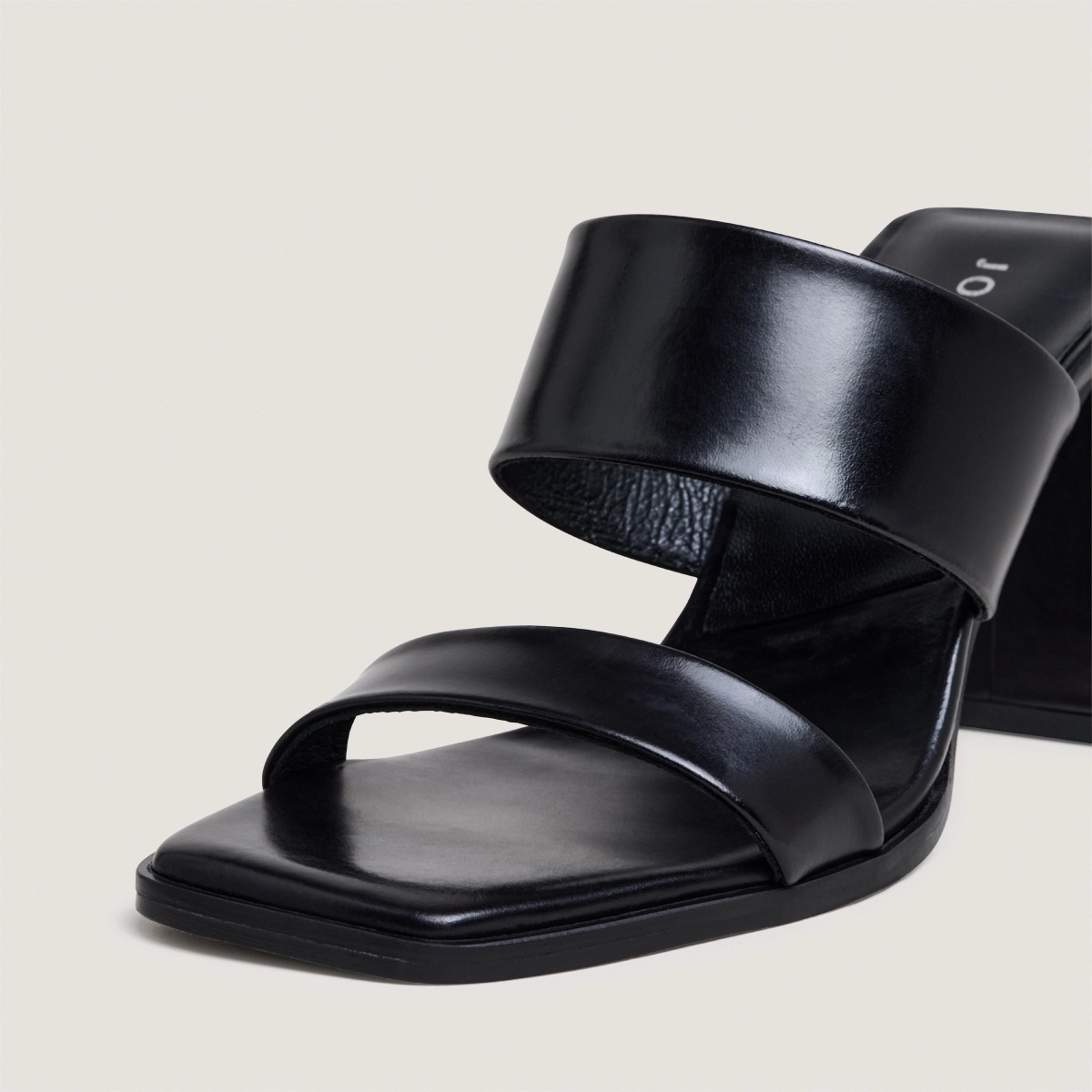 Heeled mules with double straps in black leather | BRITNEY